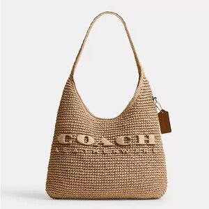 Coach Tan Crochet Hobo Bag 
Sold out everywhere 
Includes dust bag